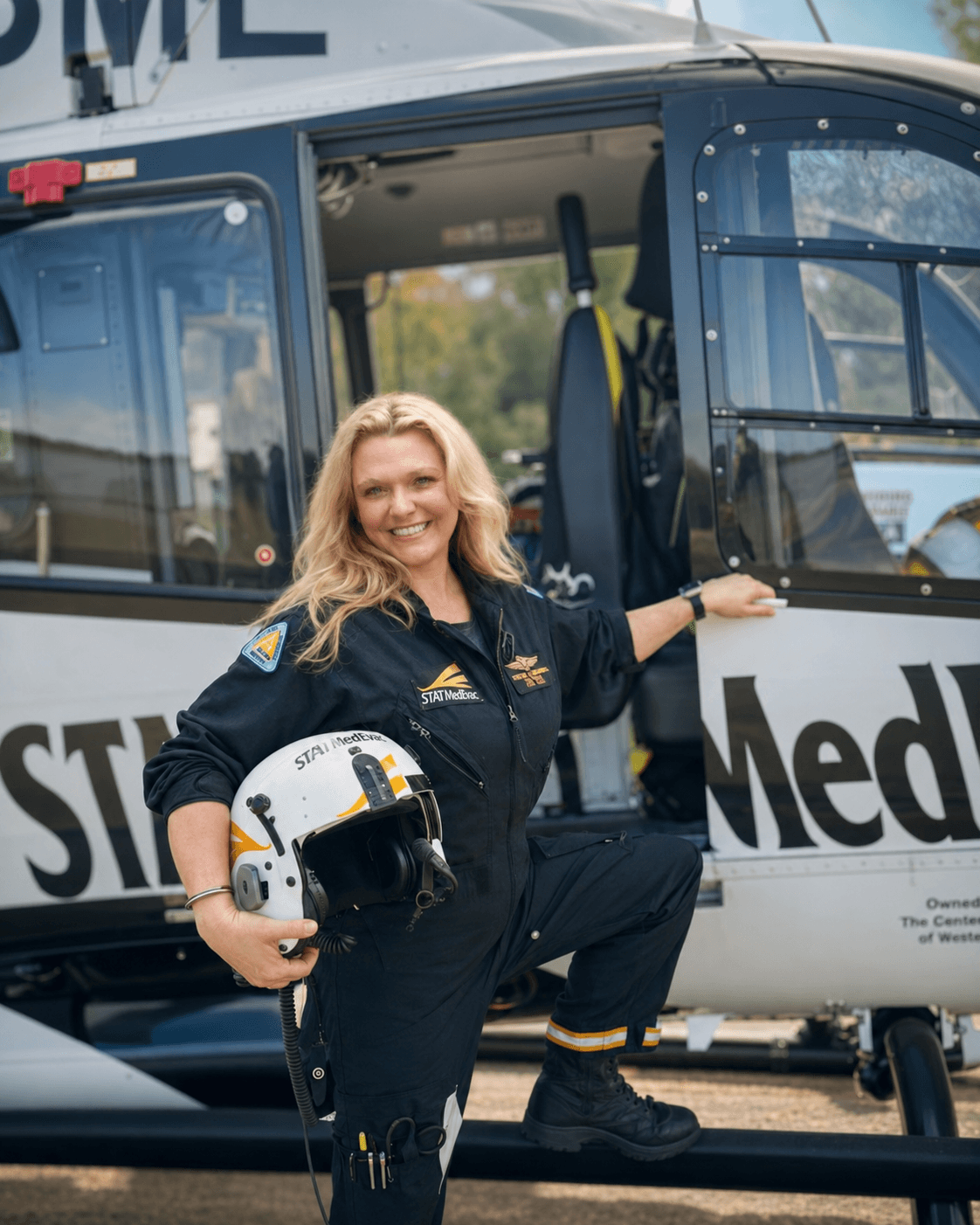 Dr. Riccio in flight suit as a STAT MedEvac critical care flight nurse